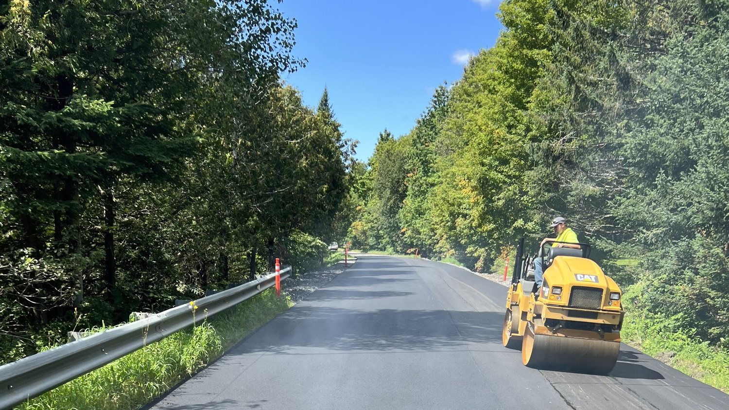 Northeast Paving CAT roller compacting a country road in Vermont