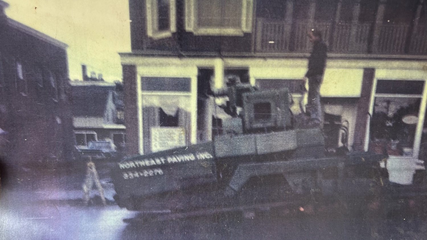 Print of a Northeast Paving Inc paver on a downtown Vermont street
