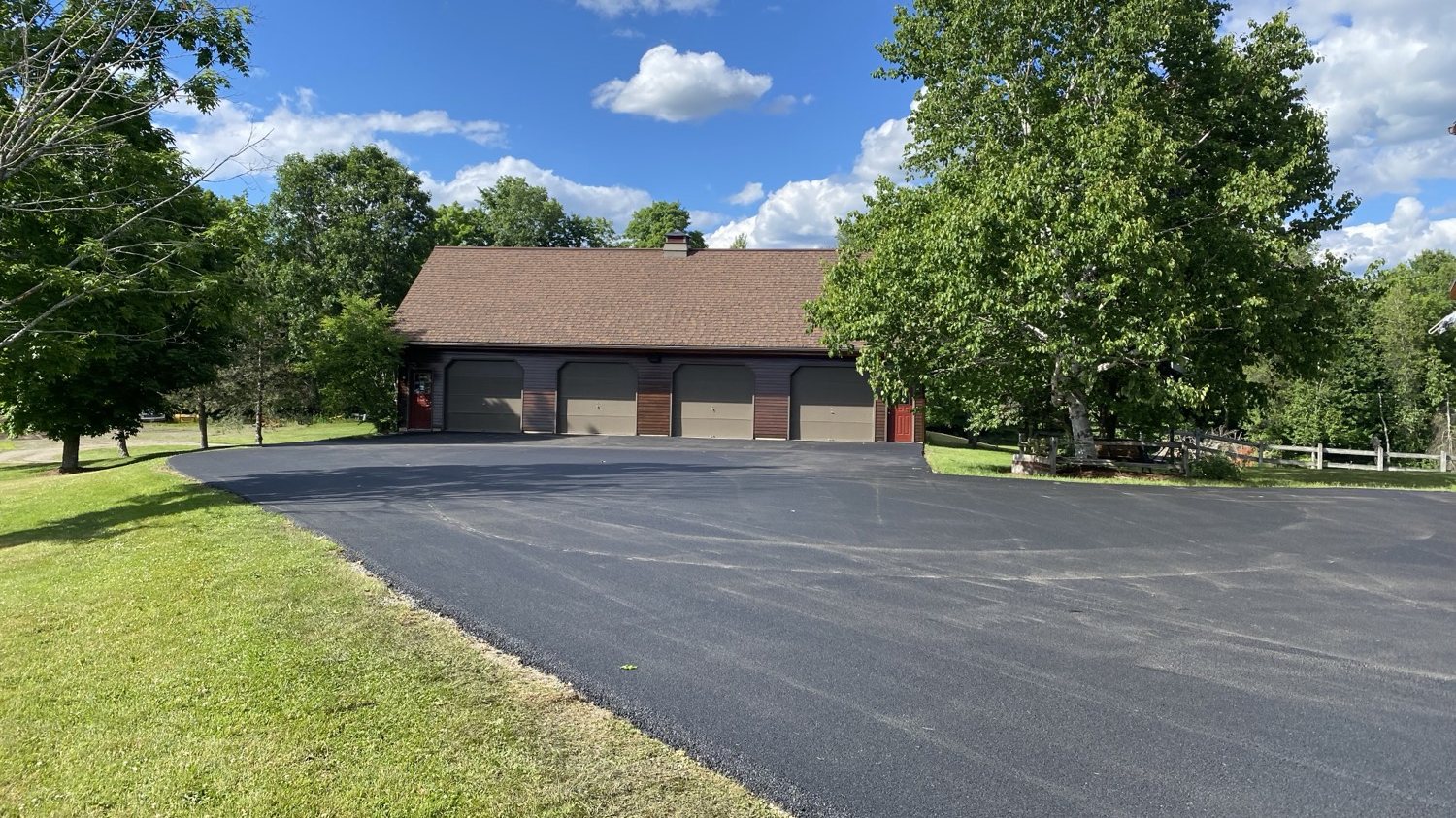 Finished four-bay garage apron at a Vermont home